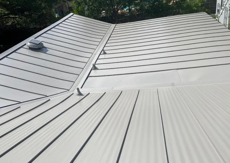 Solar attic fan installed on a metal roof for Roof Ventilation in Paducah